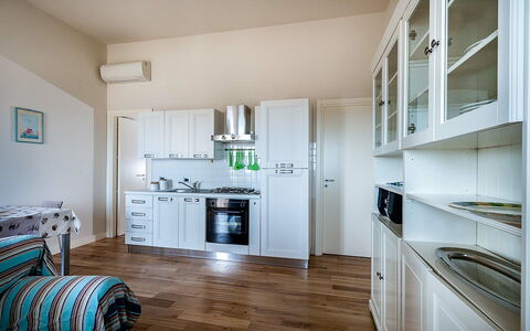 Semesterboende Timone: Kök, Lunchrum, Vardagsrum